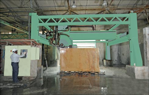 This high production block saw is shown cutting strips which are then cut into tiles on the company’s two Pedrini tile lines.