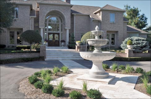 Installed at a private residence in Greenwood, Indiana, this hand-carved gray granite fountain stands over 7 feet tall, with a 5 foot diameter bottom bowl. Stone Spectrum was originally created to serve clientele looking for fountains, monuments and statuary.