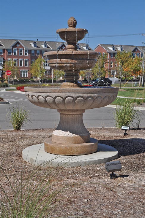 This hand-carved Golden Brown granite fountain is installed at the Barrington Assisted Living Residences in Carmel, Indiana. It is nearly 12 feet tall with a 6 foot diameter bottom bowl.