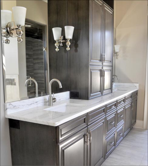 Aurora Quartzite from Brazil adorns this traditional wood cabinet master bath built by Dale Woodall Custom Homes. “When the market slowed in 2008 we saw a lot of precut material come to town. That was the way the market was heading. Then, finally I put my foot down and said, ‘We need to produce it here.’ So our goal at that time was to create a company that could compete with imports, yet produce it here in a timely fashion and not wait three months.”—Josh Spencer, Operations Manager