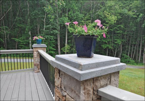 Beveled soapstone column caps repeat a rustic theme.