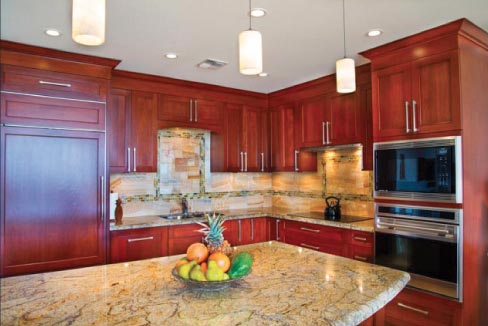 3cm Yellow River Granite is featured in this traditional  kitchen design, The full-height custom backsplash is Honey Onyx. Cabinets were supplied by Rutt Handcrafted Cabinetry.