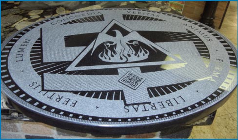 This laser-etched Black granite medallion was commissioned for a UNM student art exhibit.