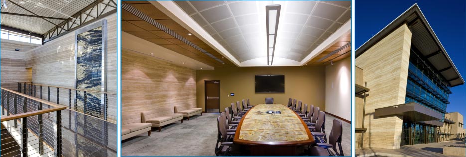 Above, Left: Upper landing wall of the MACK Energy headquarters features a bookmatched  Supreme Gold granite water feature which extends two stories.  Above, center: The MACK headquarters features Peruvian Travertine wall cladding throughout, plus a Rain Forest Green conference table. Above, Right: MACK building exterior view shows the Peruvian Travertine cladding also used on the exterior. 