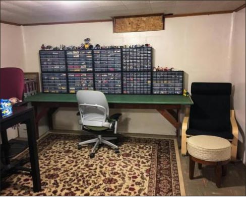 Richard’s basement Lego workshop, where some 7,000 Lego pieces were stolen while the family slept, like some Hollywood heist movie.