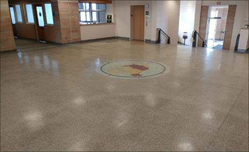 The first step toward restoring the terrazzo floors and travertine stairs (and walls) was removing over 35 years’ worth of wax and floor finish build-up. 