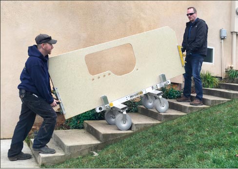 The Omni Cubed Pro-Cart AT2 and a pair of Aqua-Jaws give installers the ability (and leverage) to maneuver heavy countertops up stairs and across thresholds – and also prevent injury.