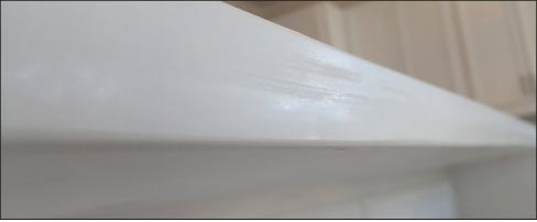 Burns and streaks on light-colored material. The streaks or burn lines are often the result of insufficent waterfeed and too much pressure while polishing. 