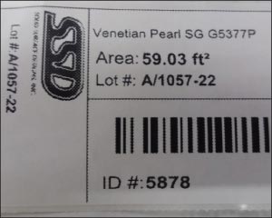 Inventory bar code sample shows square feet, location and ID number for this Venetian Pearl slab.