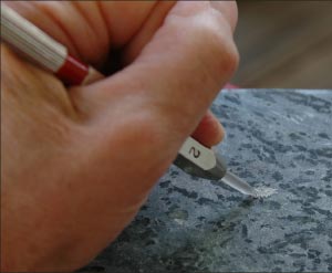 Alpine soapstone contains talc, easily scratched with a number 2 pick.