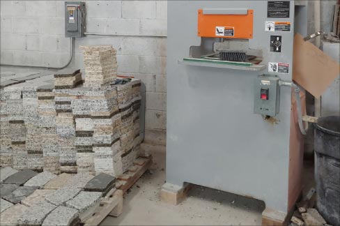 Stacks of granite remnants in the form of pavers and firepit sections await a more useful future instead of being discarded in a landfill – all part of Gecko’s emphasis on running a green, environmentally conscious shop.