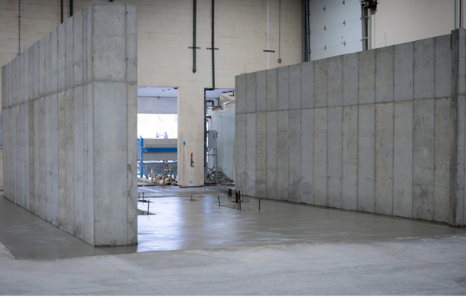 Adding infrastructure to house the 6-axis lathe involved building massive concrete support walls.