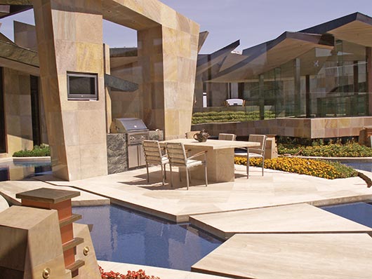 Private residence in Southwestern USA.  French Beaumaniere limestone was adhered on the deck and Panther Sandstone was mechanically attached to the exterior walls. Bisazza Glass Tile was used in the water features. CTaSC provided installation specs and quality control services for the installation of these products.