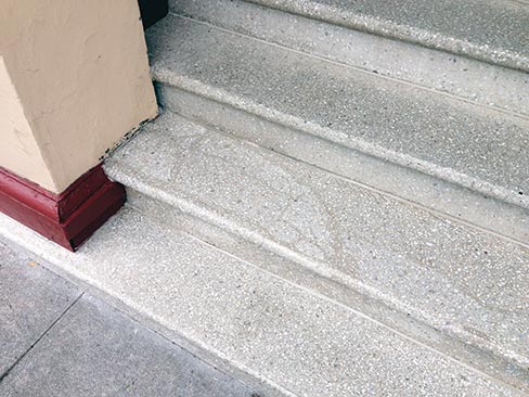 (after) Repair and restored 80-year-old terrazzo steps in a historic apartment building in Portland. Wiley repaired with epoxy/terrazzo, then cleaned and polished it all.