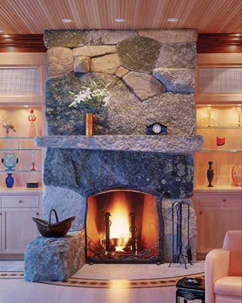 Form meets function & utilitarian art is the result in this fireplace built  from several varieties of local stone in Deer Isle, Maine. Superbly designed and constructed fireplaces using large, weathered quarried stone is just one of Freshwater Stone’s specialties.