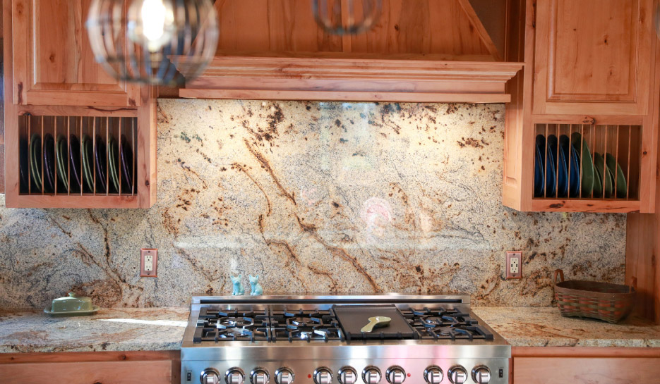 Brazilian Jaguar granite was selected for the dramatic stripes of color in this open-plan kitchen.