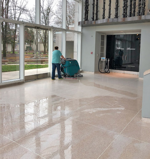 Majestic Ultra Strip, a strong alkaline solution, is being used to remove the existing floor finish on this high-traffic floor at the Knoxville Museum of Art.