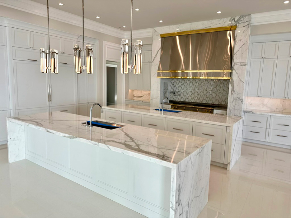 Custom residential kitchen features dual 10-foot work counters with mitered aprons.